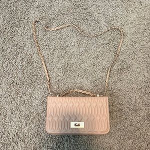 New never used. Small purse adjustable straps   As shown